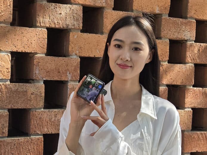 chinese model holding mi mix flip demonstrating